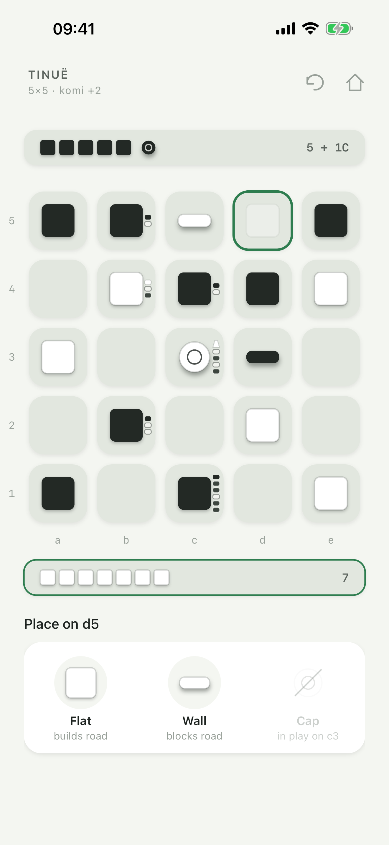 Placing on an empty square of a 5×5 board. The sheet offers Flat, which builds a road; Wall, which blocks a road; and Cap, already in play.