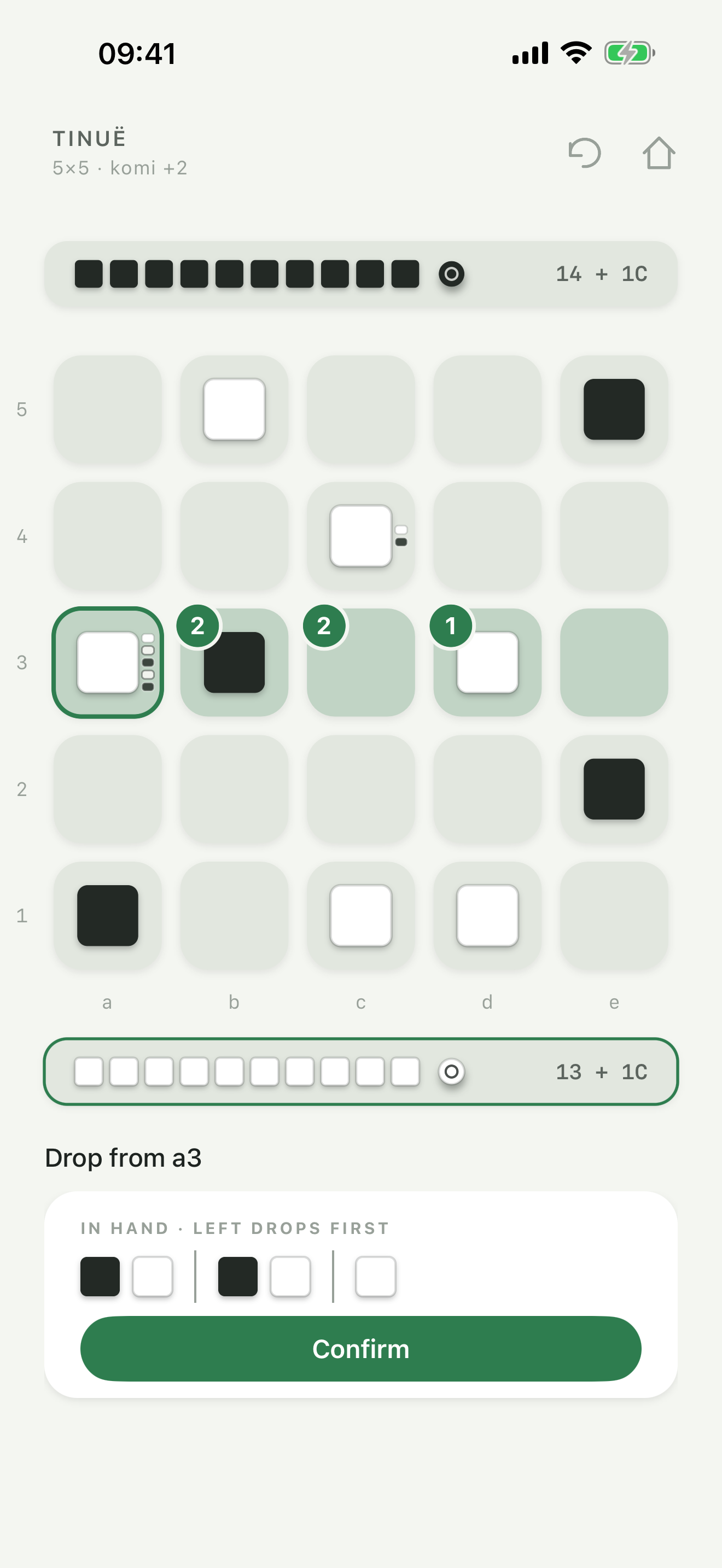 A stack leaving a3. Drops of 2, 2, and 1 are set on the next three squares, with those stones still in hand, waiting to be confirmed.